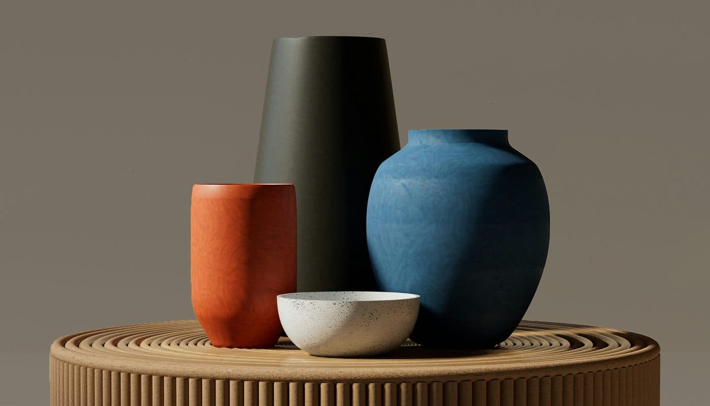 Ceramic vases and a bowl on a round wooden stand